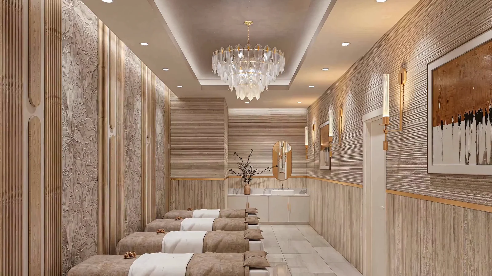 The lash room at Aloha Beauty Lounge, with a row of treatment beds beneath a crystal chandelier