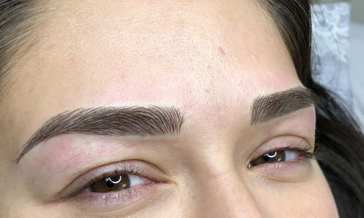 Healed hair-stroke microblading result with fuller, defined brows