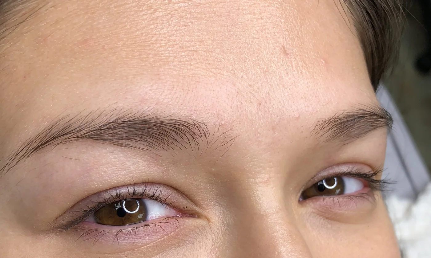 Sparse natural eyebrows before microblading at Aloha Beauty Lounge in South Jordan