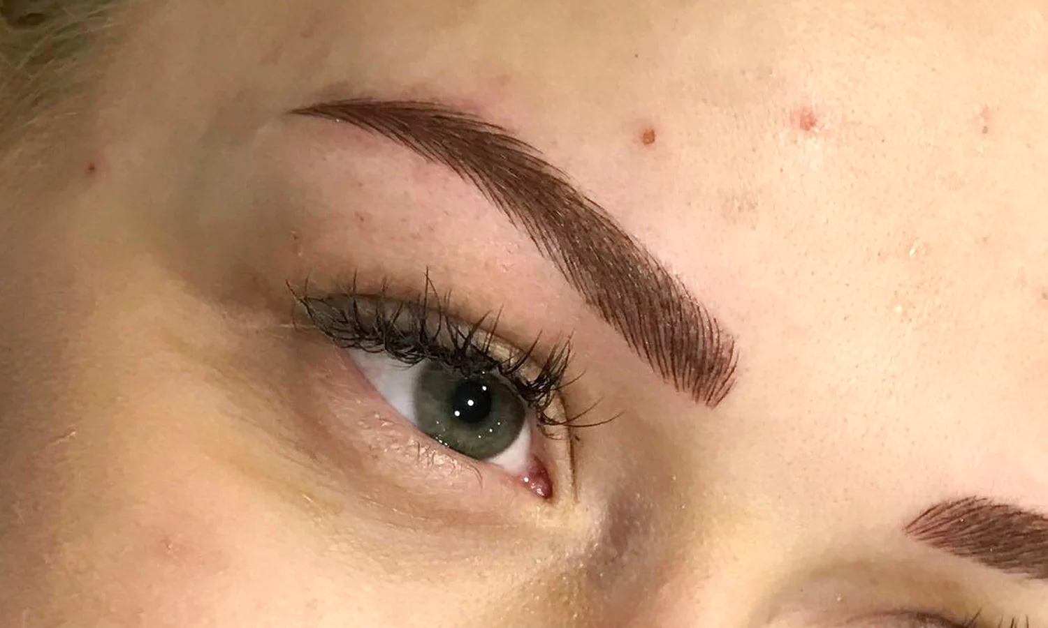 Crisp hair-stroke eyebrows after microblading at Aloha Beauty Lounge