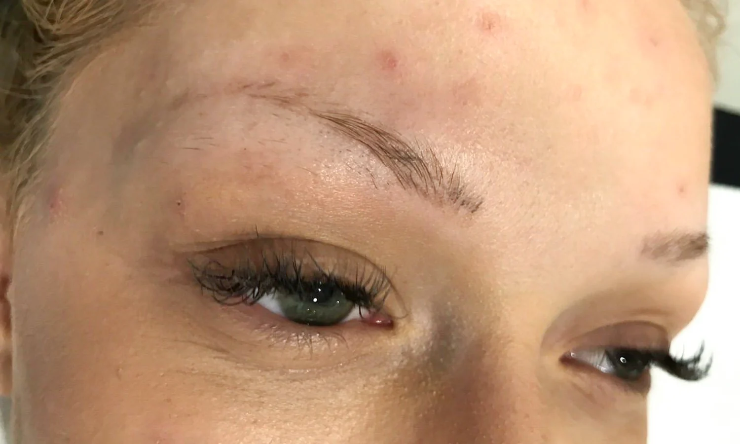Faded, patchy eyebrows before a microblading appointment